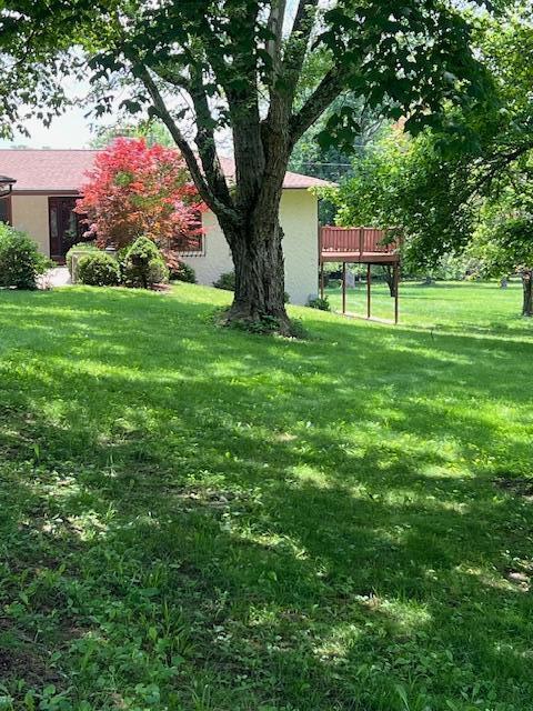171 Ginder Rd NE, Lancaster, OH 43130 - view of grassy yard with a wooden deck