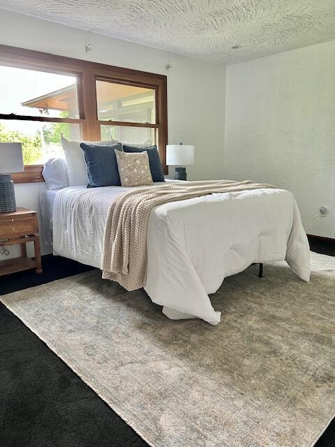 171 Ginder Rd NE, Lancaster, OH 43130 - bedroom featuring a textured ceiling and carpet
