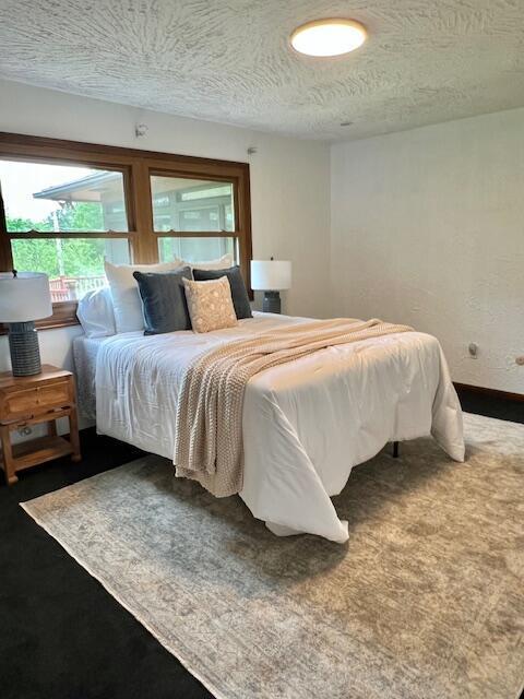 171 Ginder Rd NE, Lancaster, OH 43130 - bedroom with a textured ceiling and carpet