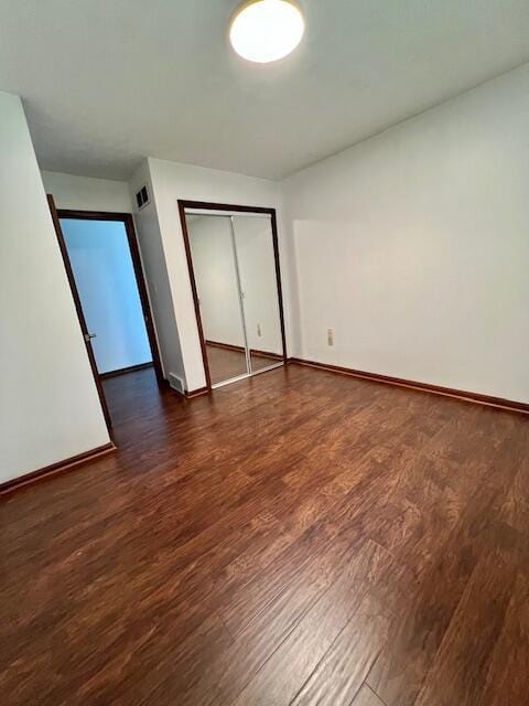 171 Ginder Rd NE, Lancaster, OH 43130 - unfurnished bedroom featuring dark wood finished floors and a closet