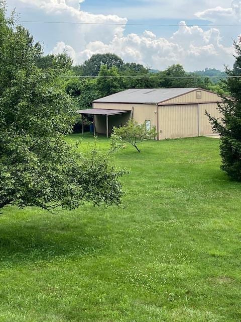 171 Ginder Rd NE, Lancaster, OH 43130 - view of grassy yard featuring an outbuilding and an outdoor structure