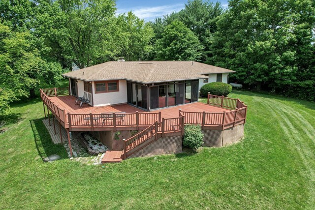 171 Ginder Rd NE, Lancaster, OH 43130 - rear view of house featuring a wooden deck, a yard, roof with shingles, and a sunroom