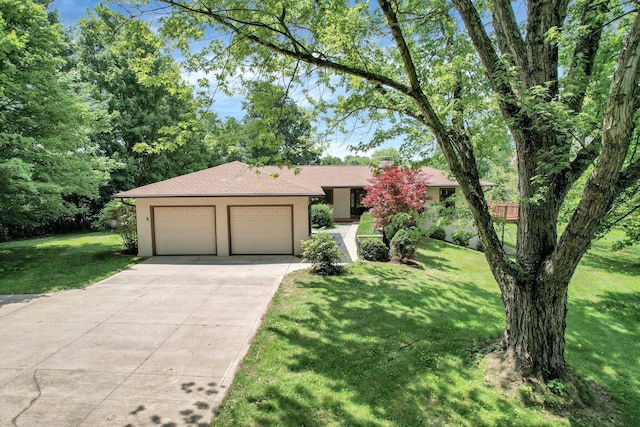 171 Ginder Rd NE, Lancaster, OH 43130 - view of front of property featuring stucco siding, a garage, a front yard, and concrete driveway