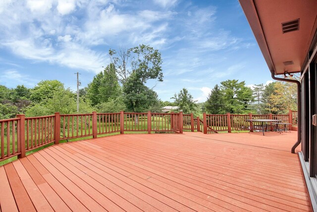 171 Ginder Rd NE, Lancaster, OH 43130 - wooden terrace with outdoor dining area and view of wooded area