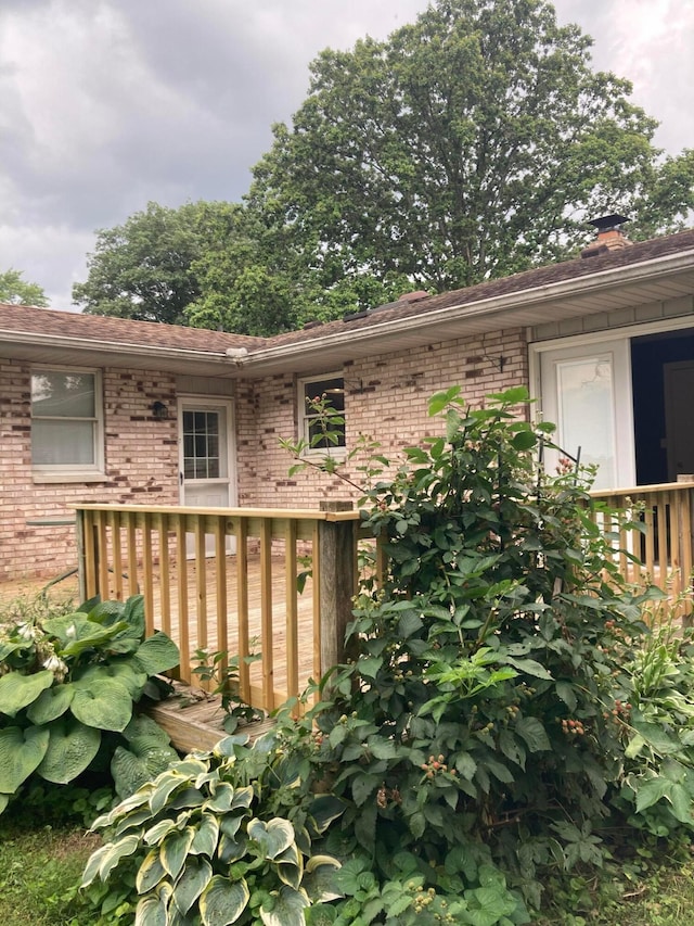 4173 Navajo Trl, Jamestown, OH 45335 - view of home's exterior with brick siding and a deck