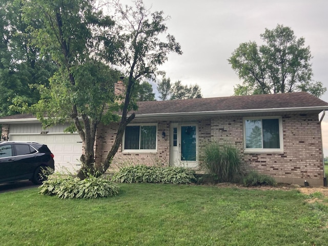 4173 Navajo Trl, Jamestown, OH 45335 - ranch-style home with brick siding, a garage, a front lawn, and a chimney