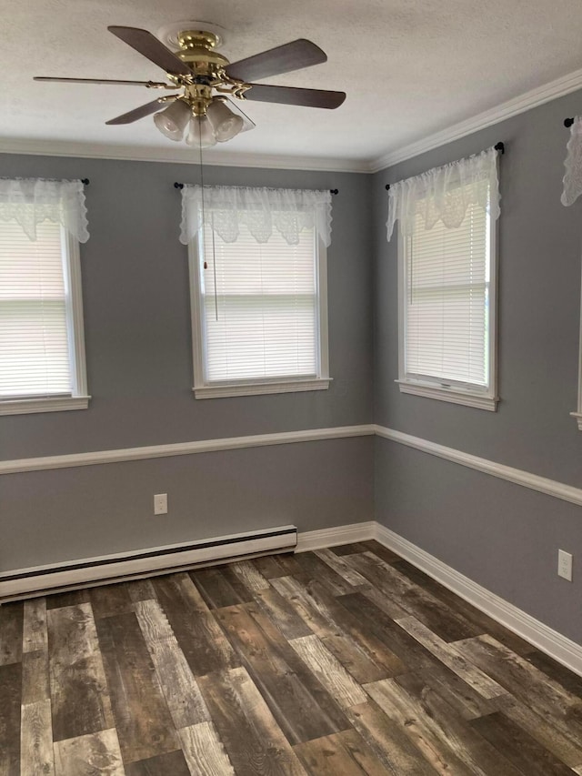 4173 Navajo Trl, Jamestown, OH 45335 - spare room with baseboard heating, ornamental molding, ceiling fan, and dark wood-type flooring
