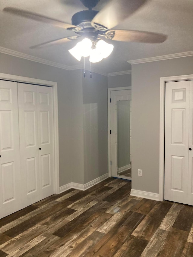 4173 Navajo Trl, Jamestown, OH 45335 - unfurnished bedroom featuring dark wood-type flooring, crown molding, a ceiling fan, and a closet