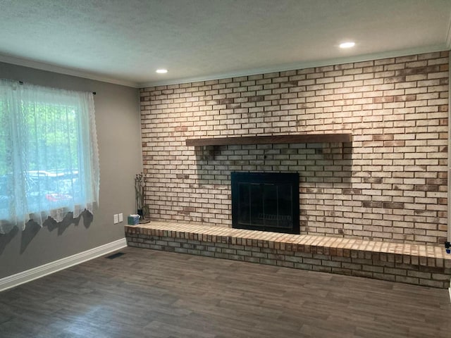 4173 Navajo Trl, Jamestown, OH 45335 - unfurnished living room featuring a fireplace, wood finished floors, ornamental molding, and recessed lighting
