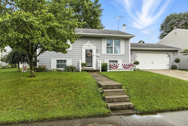 2190 Lendale Dr, Lancaster, OH 43130 - split foyer home featuring a front lawn, an attached garage, and driveway