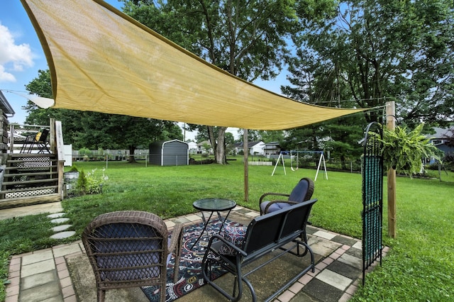 2190 Lendale Dr, Lancaster, OH 43130 - fenced backyard with a playground, a patio area, a storage shed, and a wooden deck
