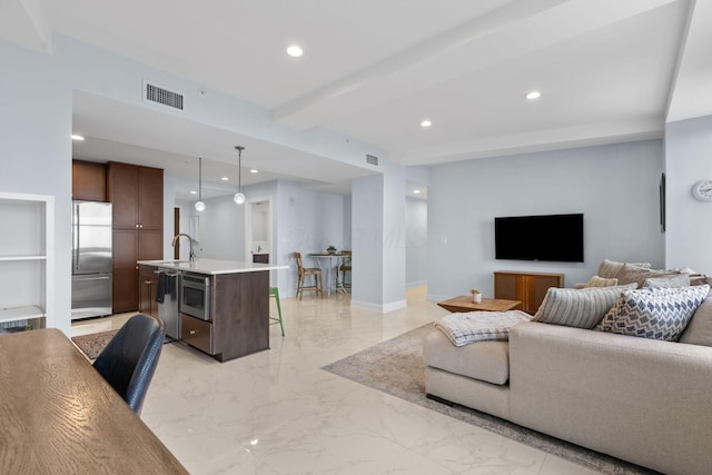 50 W Broad St Unit 3401, Columbus, OH 43215 - living room featuring beamed ceiling, recessed lighting, and light marble finish floors