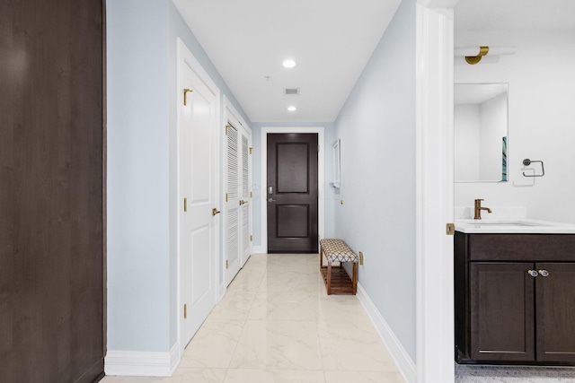 50 W Broad St Unit 3401, Columbus, OH 43215 - corridor with light marble finish floors and recessed lighting