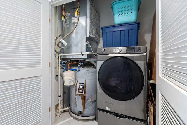 50 W Broad St Unit 3401, Columbus, OH 43215 - laundry area featuring washer / dryer and marble finish floors