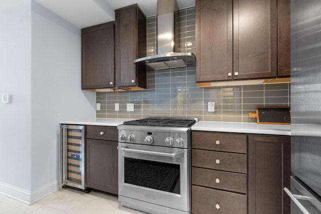 50 W Broad St Unit 3401, Columbus, OH 43215 - kitchen with stainless steel appliances, wall chimney exhaust hood, beverage cooler, and light countertops