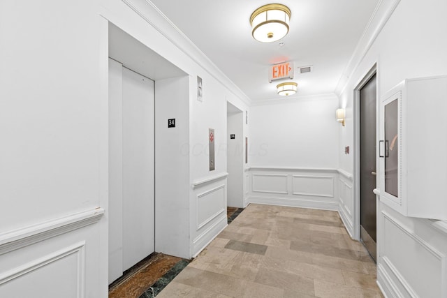 50 W Broad St Unit 3401, Columbus, OH 43215 - hallway featuring elevator, crown molding, a wainscoted wall, and a decorative wall