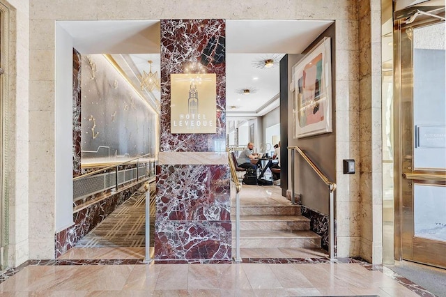50 W Broad St Unit 3401, Columbus, OH 43215 - stairs with marble tiled flooring and inlaid floor details