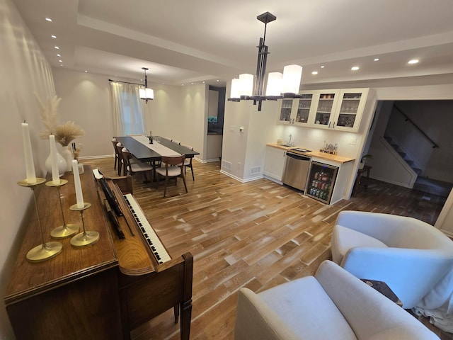 990 Venetian Way, Columbus, OH 43230 - living area featuring wet bar, light wood-style flooring, recessed lighting, wine cooler, and stairs