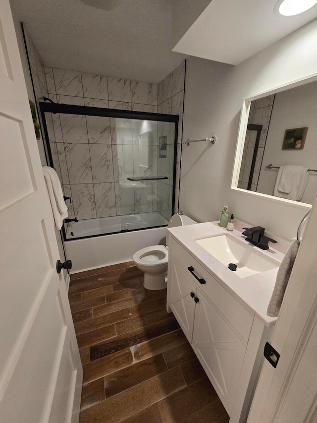 990 Venetian Way, Columbus, OH 43230 - bathroom featuring wood finish floors, vanity, and shower / bath combination with glass door