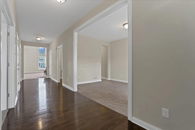 7263 Yarrow Run Rd, Plain City, OH 43064 - hallway with baseboards and dark wood finished floors