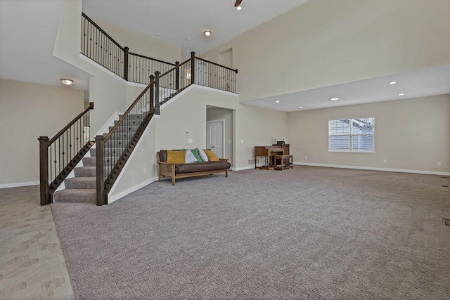 7263 Yarrow Run Rd, Plain City, OH 43064 - carpeted living area with a towering ceiling and stairway