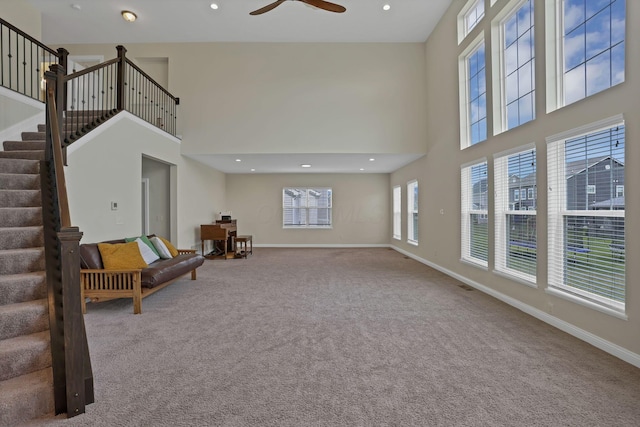 7263 Yarrow Run Rd, Plain City, OH 43064 - living room with a towering ceiling, carpet flooring, stairway, a ceiling fan, and recessed lighting