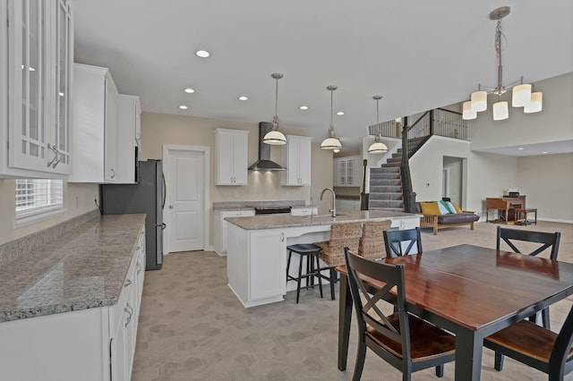 7263 Yarrow Run Rd, Plain City, OH 43064 - dining room with stairway, recessed lighting, and a chandelier