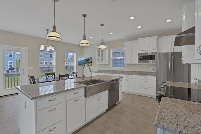 7263 Yarrow Run Rd, Plain City, OH 43064 - kitchen featuring stainless steel appliances, recessed lighting, white cabinetry, wall chimney exhaust hood, and pendant lighting