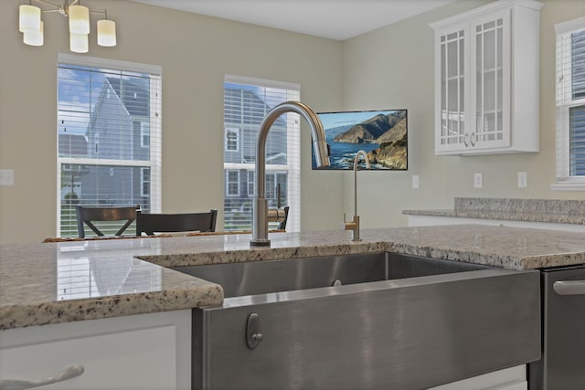 7263 Yarrow Run Rd, Plain City, OH 43064 - kitchen featuring light stone counters, white cabinetry, and glass insert cabinets