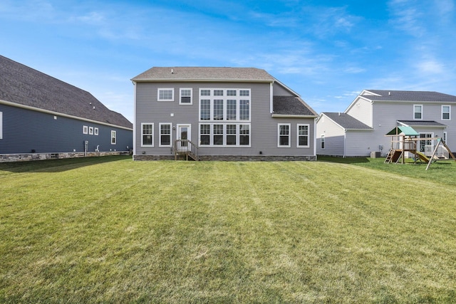 7263 Yarrow Run Rd, Plain City, OH 43064 - rear view of house featuring a yard, a playground, and entry steps