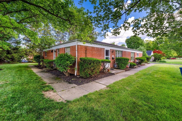 3016 Welsford Rd, Columbus, OH 43221 - view of home's exterior with brick siding and a lawn