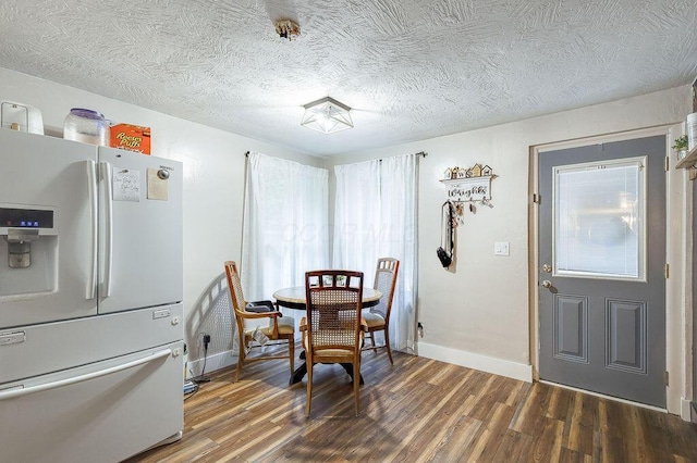 9020 Kinney Rd, Mount Vernon, OH 43050 - dining space with wood finished floors, plenty of natural light, and a textured ceiling