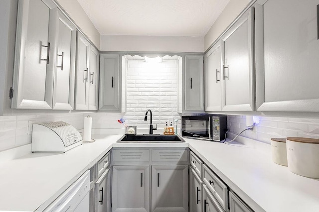 9020 Kinney Rd, Mount Vernon, OH 43050 - kitchen featuring black microwave, backsplash, light countertops, and gray cabinets
