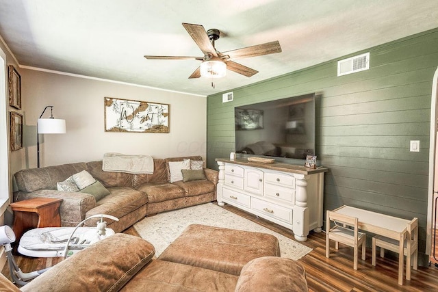 9020 Kinney Rd, Mount Vernon, OH 43050 - living area with a ceiling fan, light wood-style flooring, ornamental molding, and wooden walls