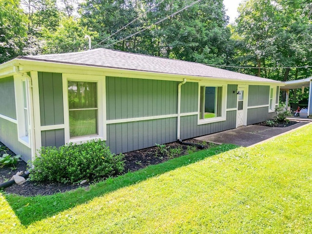 9020 Kinney Rd, Mount Vernon, OH 43050 - view of side of property with a yard and roof with shingles