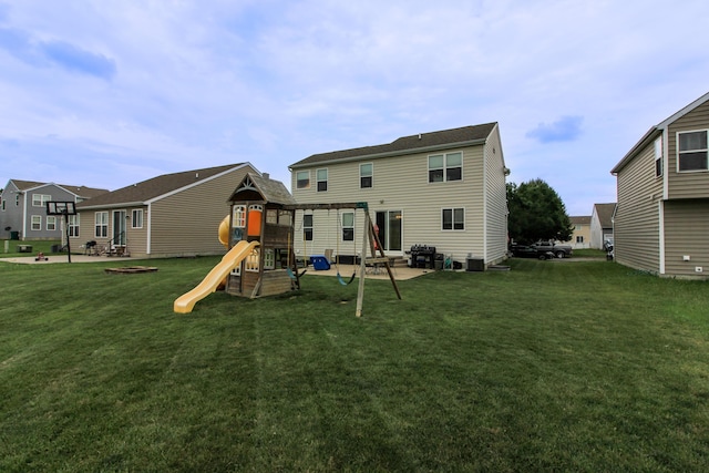 9065 Strawser St, Orient, OH 43146 - back of house featuring a playground, a lawn, and a patio area