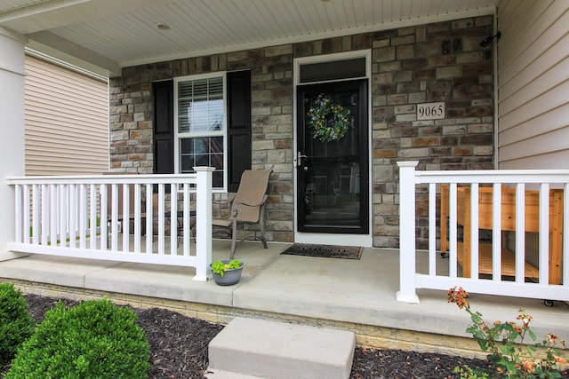 9065 Strawser St, Orient, OH 43146 - doorway to property featuring covered porch and stone siding