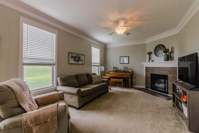 9065 Strawser St, Orient, OH 43146 - living area with a ceiling fan, crown molding, a tile fireplace, and carpet