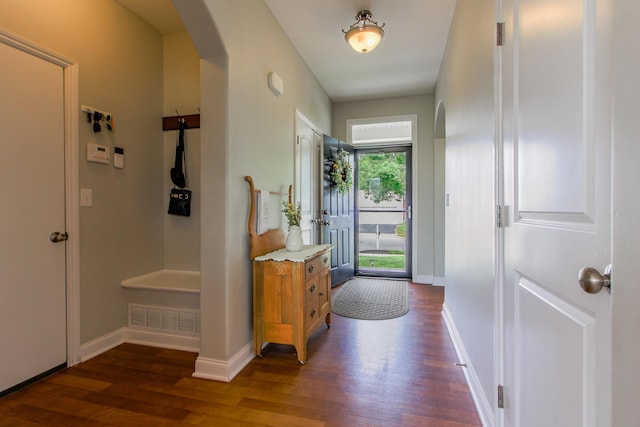 9065 Strawser St, Orient, OH 43146 - foyer featuring arched walkways and dark wood-type flooring