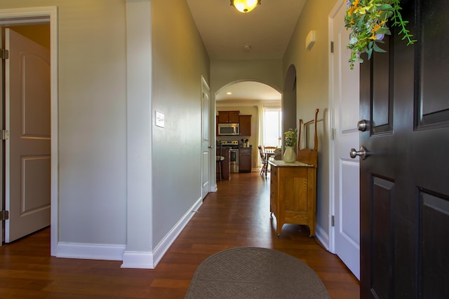 9065 Strawser St, Orient, OH 43146 - hall with arched walkways and dark wood-style floors