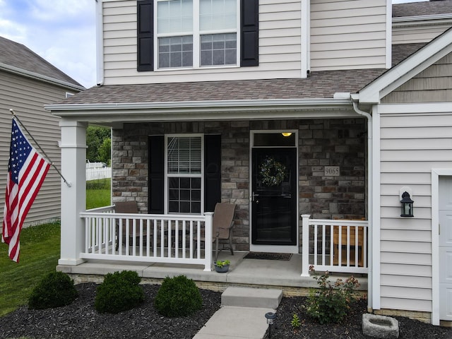 9065 Strawser St, Orient, OH 43146 - entrance to property with a porch, a shingled roof, and stone siding