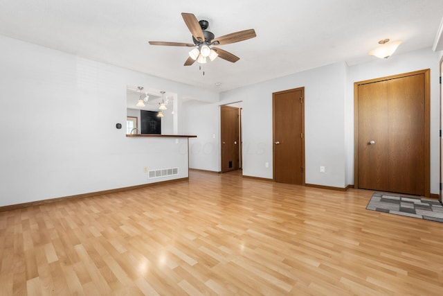 277 Plum Run Ct, Commercial Point, OH 43116 - unfurnished living room with light wood-style flooring and a ceiling fan