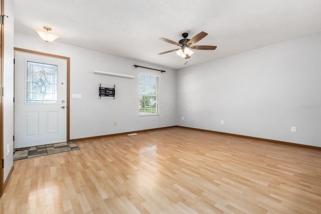 277 Plum Run Ct, Commercial Point, OH 43116 - foyer entrance with light wood finished floors and a ceiling fan