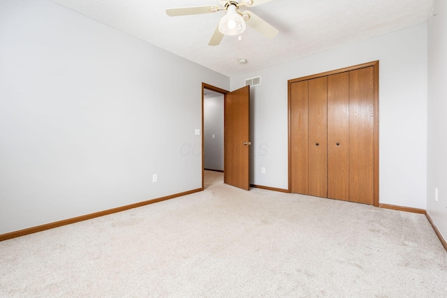 277 Plum Run Ct, Commercial Point, OH 43116 - unfurnished bedroom with light carpet, a closet, and ceiling fan
