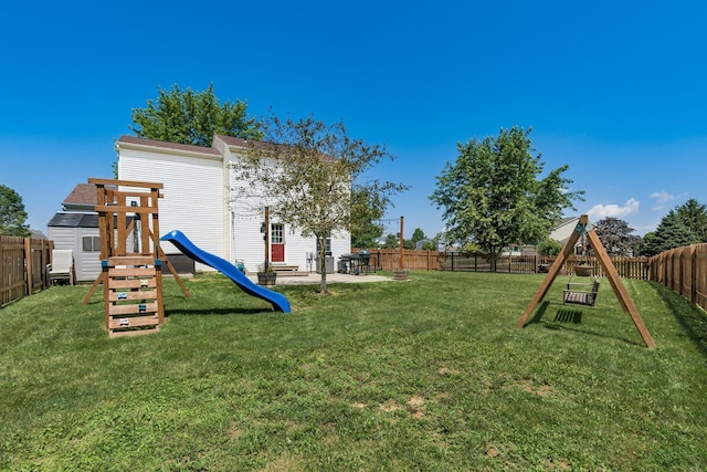 277 Plum Run Ct, Commercial Point, OH 43116 - fenced backyard featuring a playground