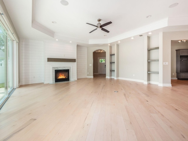 3311 Polden Hill Dr Unit 24, New Albany, OH 43054 - unfurnished living room featuring ceiling fan, plenty of natural light, a premium fireplace, crown molding, and recessed lighting