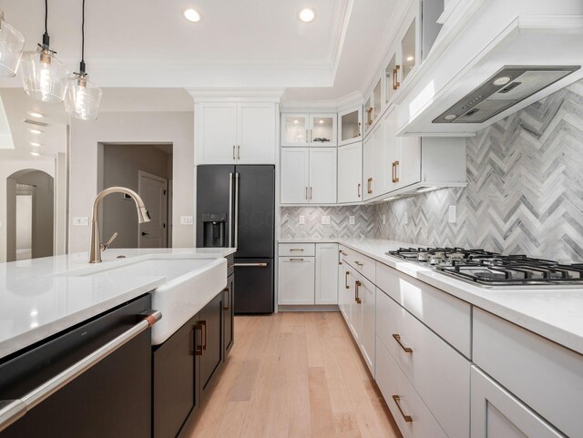 3311 Polden Hill Dr Unit 24, New Albany, OH 43054 - kitchen with dishwasher, stainless steel gas cooktop, black refrigerator with ice dispenser, recessed lighting, and extractor fan