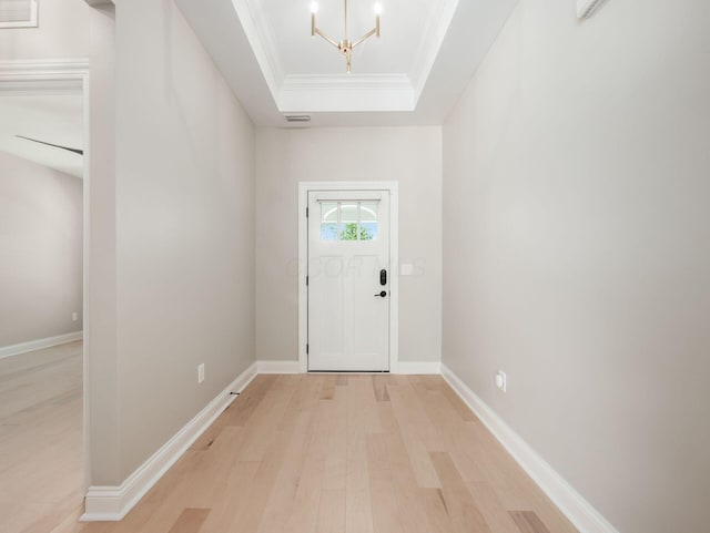 3311 Polden Hill Dr Unit 24, New Albany, OH 43054 - foyer with a tray ceiling, ornamental molding, light wood-type flooring, and a chandelier