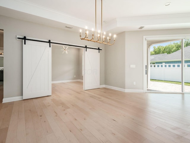 3311 Polden Hill Dr Unit 24, New Albany, OH 43054 - unfurnished dining area with a barn door, ornamental molding, light wood finished floors, a chandelier, and recessed lighting