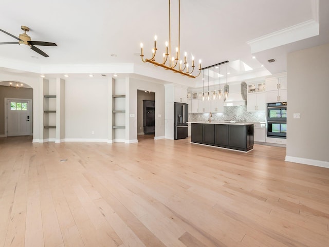 3311 Polden Hill Dr Unit 24, New Albany, OH 43054 - unfurnished living room featuring a chandelier, ceiling fan, crown molding, light wood finished floors, and recessed lighting
